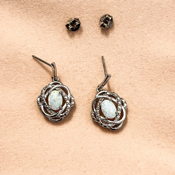 Lab created opals set in silver earrings. - Picture 6 of 6